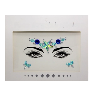 Detail of blue pentagram face crystal sticker with mixed resin rhinestones for EDM festivals
