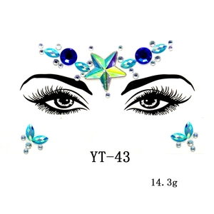 Blue iridescent butterfly and star facial gem stickers for artistic party makeup