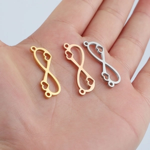 Polished stainless steel infinity heart pendants in gold, rose gold, and silver finishes