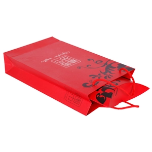 Red gift packaging set with floral carrier bag and scarf box for elegant presentation
