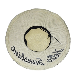 Beige wide brim straw sun hat with Hello Sunshine embroidery and fringe trim decoration
