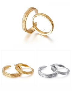 Detail of 18K gold vacuum plated feather rings with 3mm and 4mm width specifications