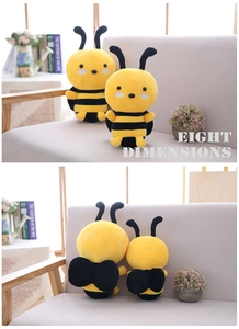 Front and back views of two cute plush bee toys in a cozy home setting with a grey sofa