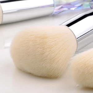Macro view of dense synthetic bristles and silver metal ferrule on makeup brush