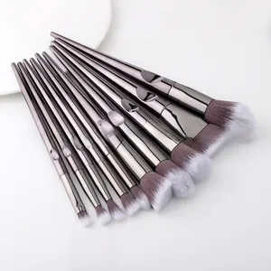 Detail of 12-piece makeup brush set featuring gunmetal handles and gradient fiber bristles