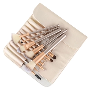 Champagne gold makeup brush set with white bristles and beige PU leather storage pouch