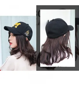 Detailed embroidery of yellow towel M letter and tiger motif on a black baseball cap