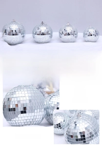 Close-up of reflective disco mirror balls in various sizes with hanging loops for party decor