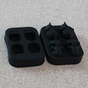Black silicone skull ice cube tray mold with a four-cavity design for DIY cocktails