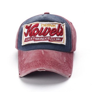 Macro shot of vintage washed baseball cap with embroidered patch and distressed detail