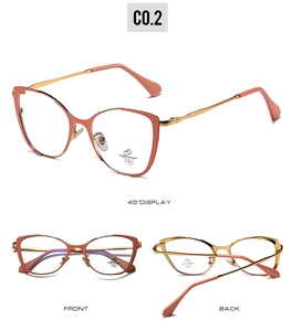 Detail view of pink cat eye frames with gold metal temples and blue light filter lenses
