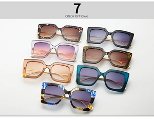 Flat lay display of oversized square cat-eye sunglasses available in seven assorted colors
