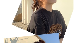 Detail des Leopardenmusters und weißen 'Cute'-Schriftzugs auf dem schwarzen Baumwoll-T-Shirt