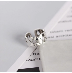 Silver woven crisscross open ring with adjustable minimalist interlocking metal texture