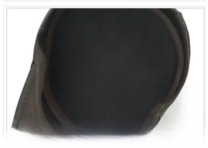 Detailed view of internal stitching and brown binding tape inside the grey baseball cap