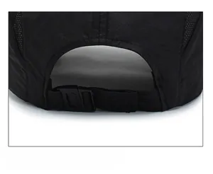 Detail of adjustable strap with plastic buckle on a breathable mesh sports cap