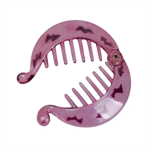 Close-up of a purple translucent banana hair clip with saw-tooth pattern and inner teeth