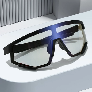 Cycling sunglasses with shield frame and blue reflective lenses on a minimalist stand
