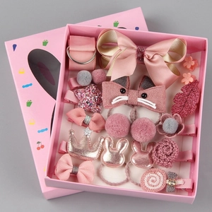Detailed view of 18-piece pink children hair accessories gift set with ribbons and bows