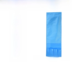 Detail view of pink and blue hanging organizers with four small storage pockets for bedside use
