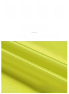 Close-up of thick neon yellow Oxford cloth fabric showing durable woven texture