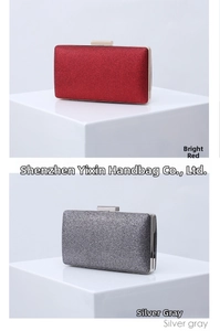 Close-up of sparkling sequin fabric texture on red and silver gray evening clutch bags