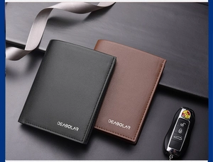 Close-up of elegant black and brown men's trifold wallets with refined stitching details