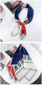Detail of silk scarf with artistic piano key pattern and elegant block print design