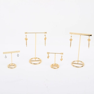 Golden metal T-bar earring display stands with circular bases in various heights