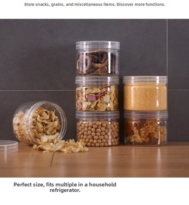 Close-up of stacked clear plastic storage jars with airtight silver screw lids