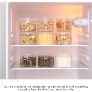 Stacked airtight clear jars in fridge for grains and dry food storage with white lids