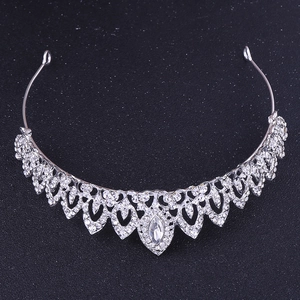 Detail of silver bridal crown with leaf patterns and sparkling crystal rhinestones