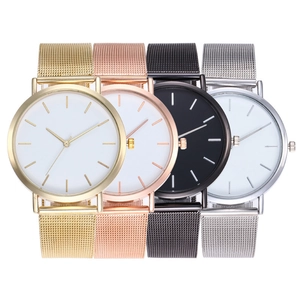 Four minimalist quartz watches with metallic mesh bands in gold, rose gold, black, and silver