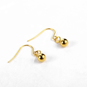 Detailed view of polished 18K gold-plated spherical bead earrings with elegant hook style