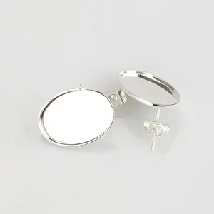 Detailed view of silver oval earring posts with butterfly backs for DIY jewelry making