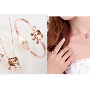 Rose gold stainless steel jewelry set featuring lucky lock pendant, bracelet and ring