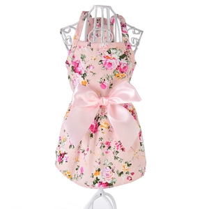 Pink floral cotton dog princess dress with large satin bow on white mannequin stand