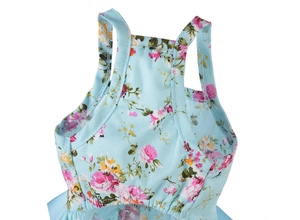 Close-up of pink rose floral print and fine stitching on blue cotton pet dress straps