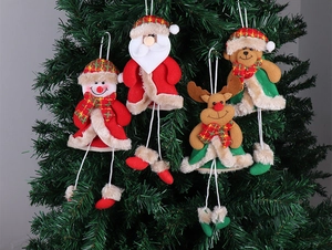 Detailed close-up of 4-piece plush Christmas hanging ornaments with long legs on a tree