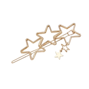 Minimalist gold star hair clip with dangling celestial chain charms on white background