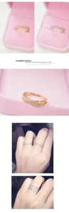 Detailed macro view of crisscross micro-pave zircon rings in gold and silver plating