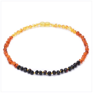 Detail of natural Baltic amber necklace featuring multicolored beads with organic texture