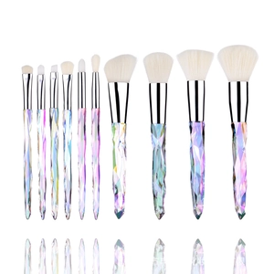 Detailed display of 10 crystal handle makeup brushes with iridescent diamond texture