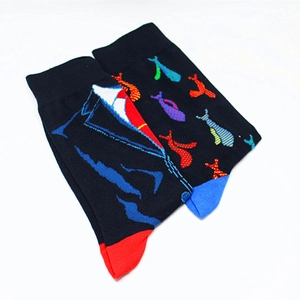 Detail of creative cotton crew socks featuring tuxedo prints and vibrant contrast heels