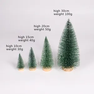 Size chart showing height and weight for mini snow-dusted Christmas trees from 10 to 30 cm