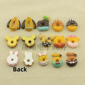 Detailed view of colorful 3D resin donut charms with metal loops for DIY crafts