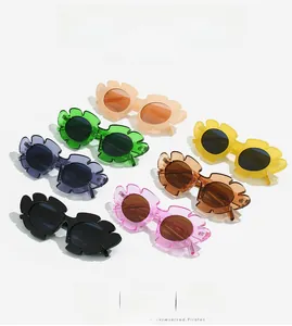 Detailed flat lay of trendy daisy-shaped sunglasses in six vibrant jelly colors