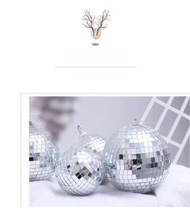 Detailed view of silver disco mirror balls in various sizes with metal hanging rings