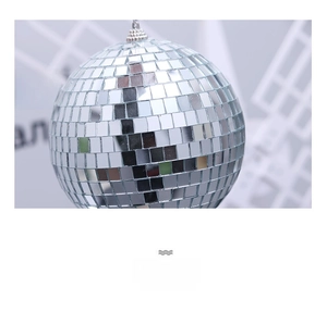 Macro detail of silver disco ball with reflective mirror glass tiles and top hanging loop