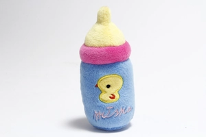 Detail of plush baby bottle toy with colorful fabric and Meissa chick embroidery